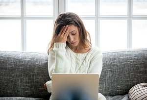 Woman with tension headache. - Copyright – Stock Photo / Register Mark