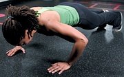 Chelsea Cooper performing pushup. - Copyright – Stock Photo / Register Mark