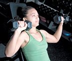 Chelsea Cooper performing incline dumbbell chest press. - Copyright – Stock Photo / Register Mark