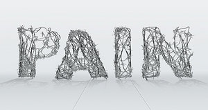 The word pain spelled out with barbed wire. - Copyright – Stock Photo / Register Mark